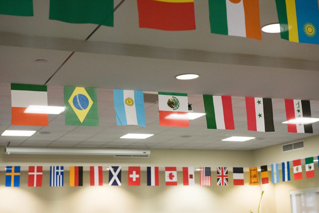 Many international flags put in a room