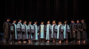 Doctoral candidates and faculty pose following the College of Education Graduate School Commencement