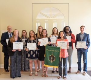 Mutliple people receiving their Sigma Beta Delta diploma