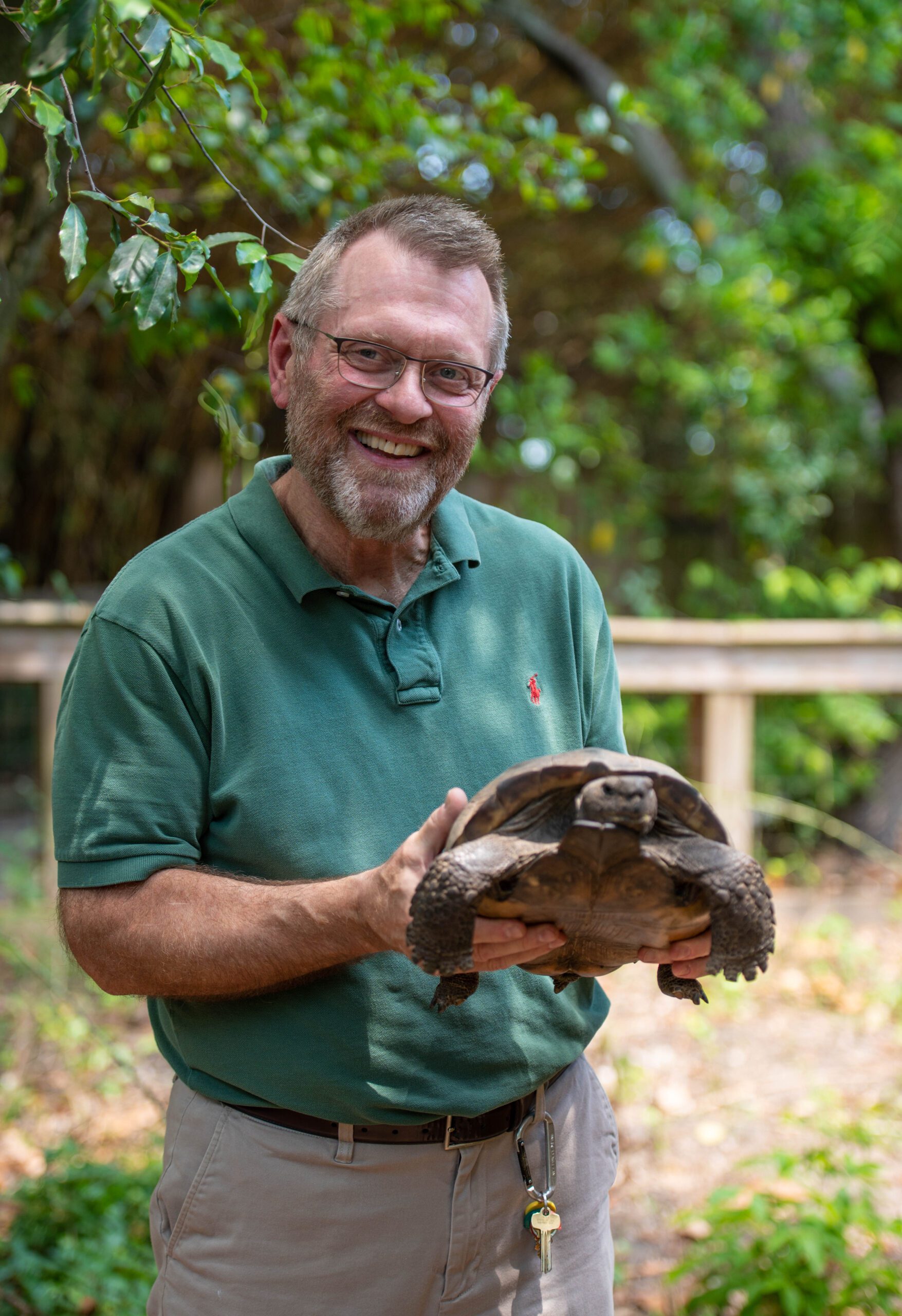 Dr. Todd Heldreth, professor of biology, examines a gopher tortoise, an endangered species in South Carolina. Heldreth serves as the vet for the Animal Forest at Charles Towne Landing, part of the South Carolina State Park system.