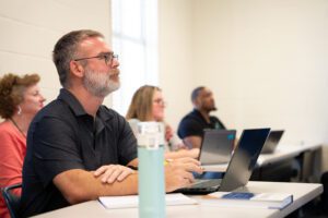 Adults who are listening and paying attention in class|A picture of andragogy in practice- goals and purposes for learning