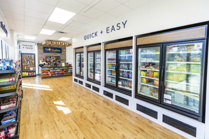 Interior of the quick service Galley market with refrigerated drinks and grab and go shelves of food items