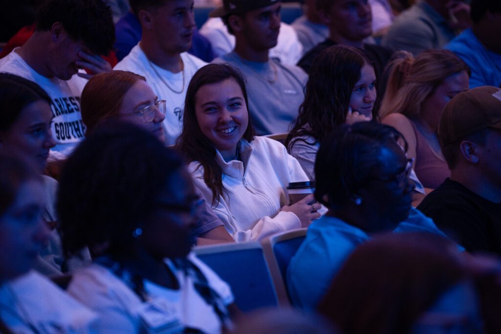 Student sitting in Chapel ready to listen to Jody Jennings (the speaker at Chapel)