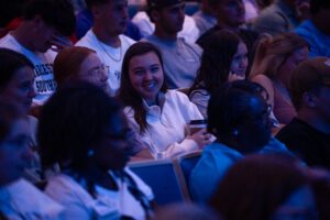 Student sitting in Chapel ready to listen to Jody Jennings (the speaker at Chapel)