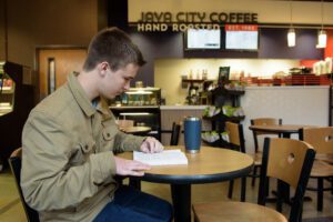 Micah's coffee from Java will soon be history as he studies for history early morning.