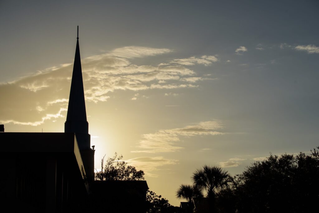 A sunset sky with a silhouette of CSU's Chapel