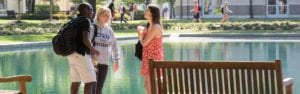 Campus life at CSU, students socialize in front of the reflection pond