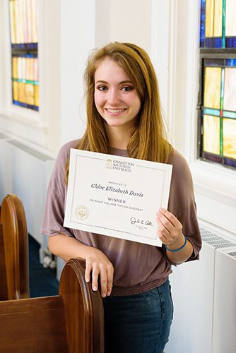 Winner of the His Radio Tuition Giveaway contest, Chloe Davis, holding her certificate.