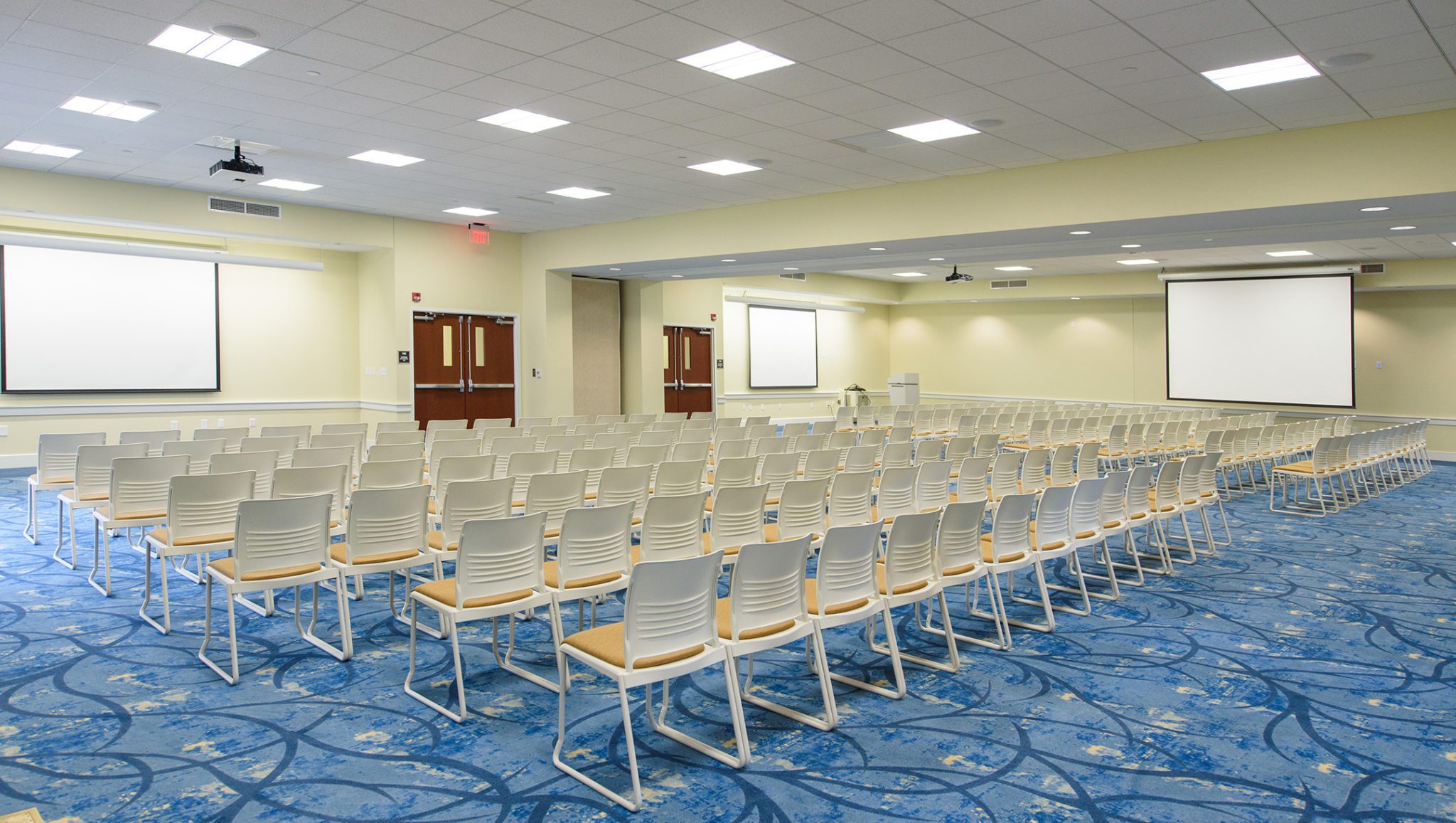 CSU event space Whitfield Center Drew Conference Room with chairs and projection screens setup.