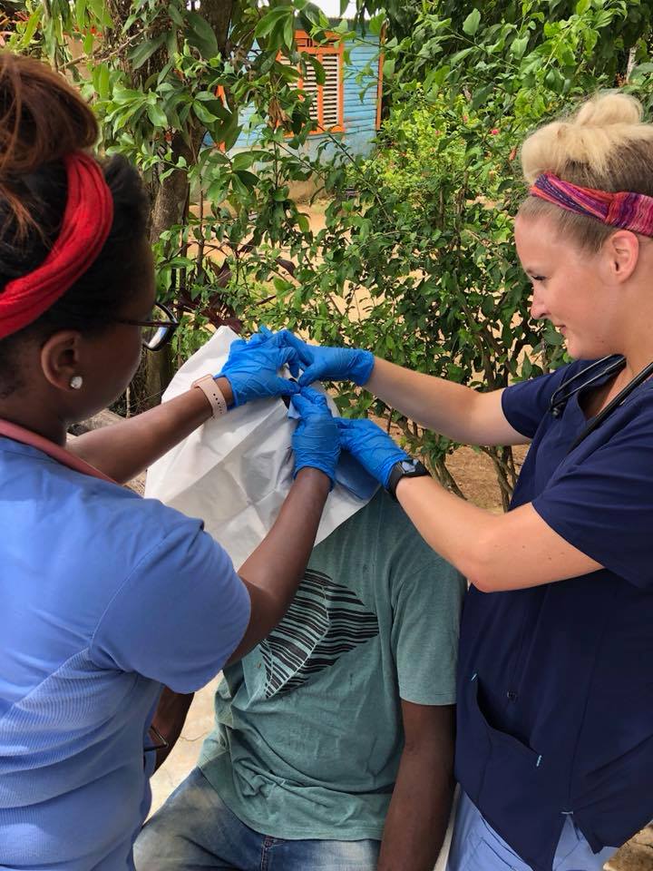 Faculty and students from CSU's PA program treat a patient in Dominican Republic