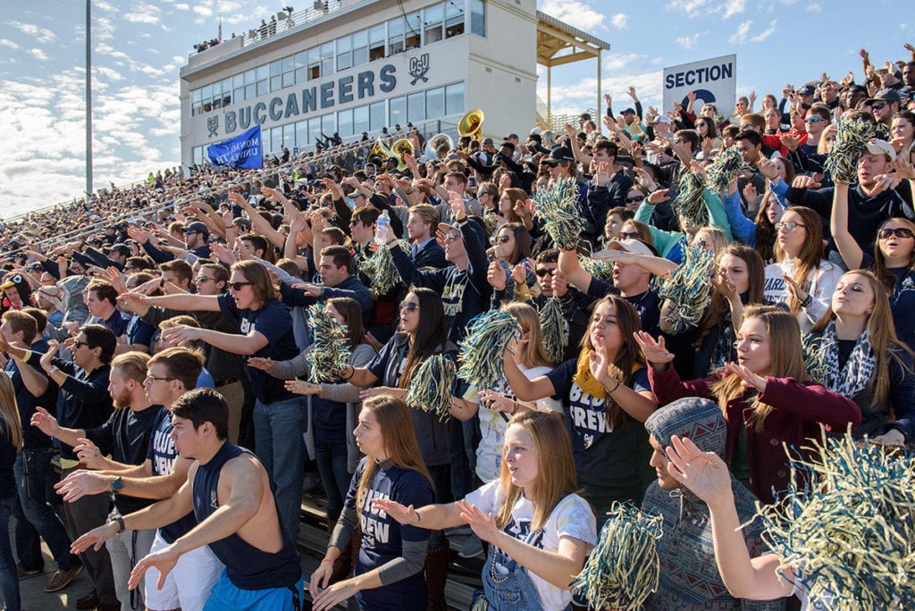 Fans cheering during a CSU football game.