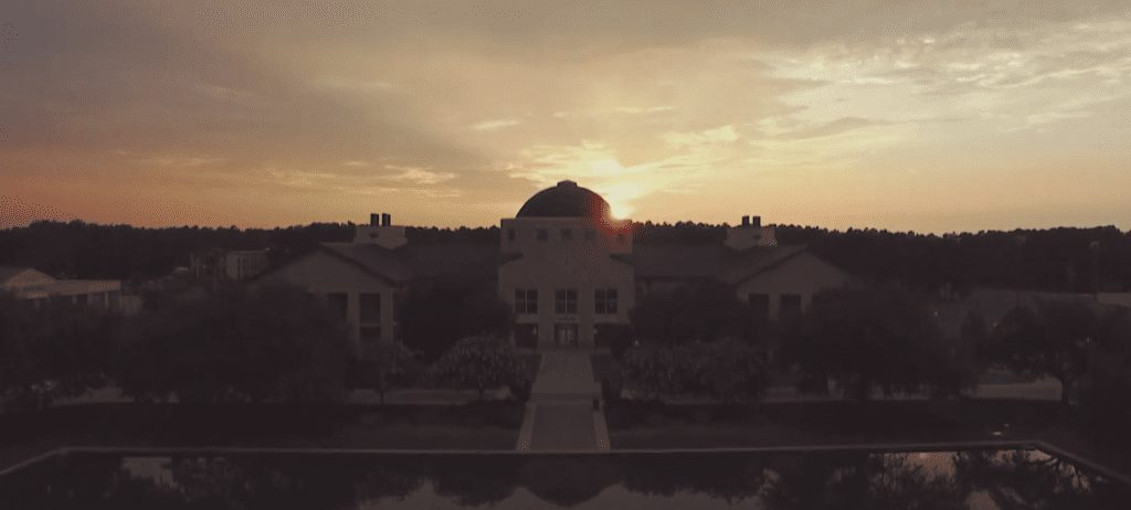 CSU's Science Building with the sun setting behind it.