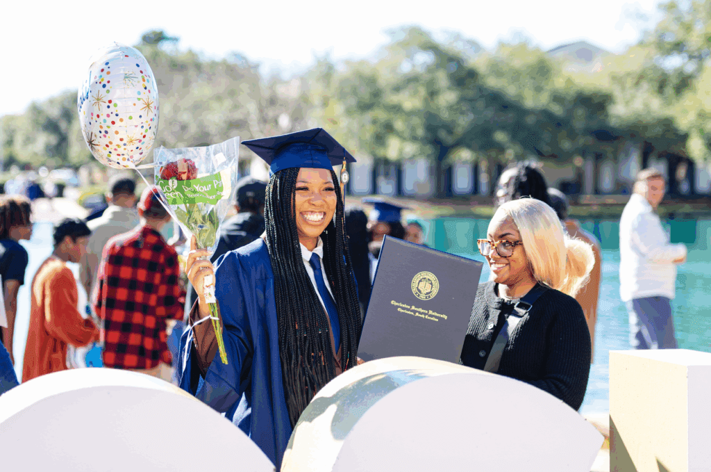 Graduate at Charleston Southern University smiles in celebration