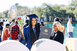 Graduate at Charleston Southern University smiles in celebration
