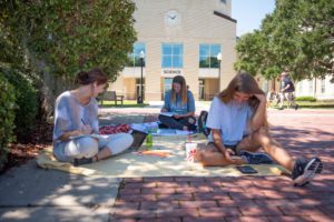 Students studying near the Reflection Pond