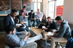 Students gathers in Java City coffee shop having a bible study.