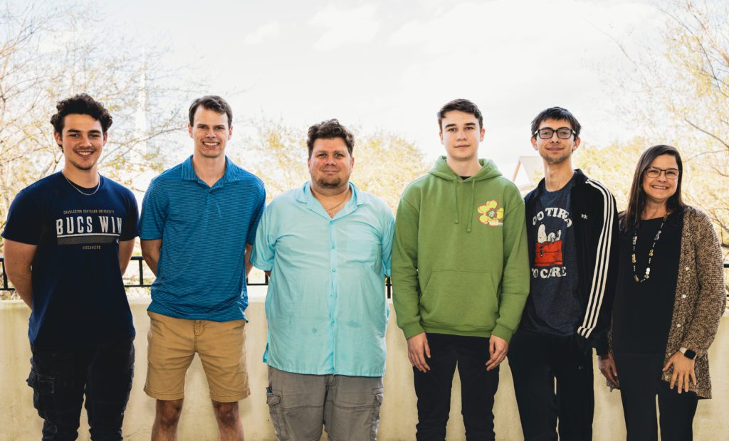 The cybersecurity team, taking a groups picture outside