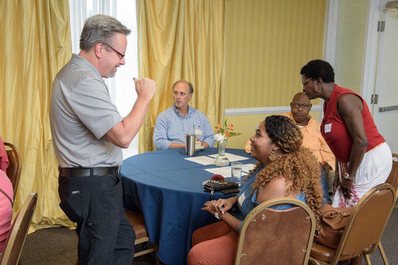 David Britt meets with online students at an event