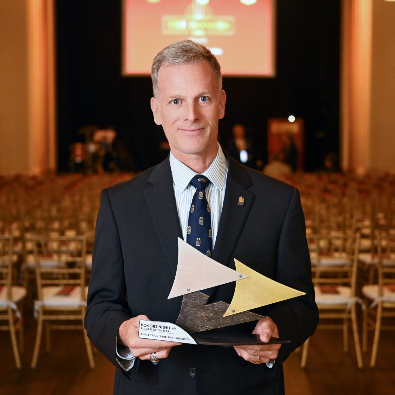 Dr. Dondi Costin with the Business of the Year trophy awarded to Charleston Southern University. Photo by Charleston Metro Chamber of Commerce.