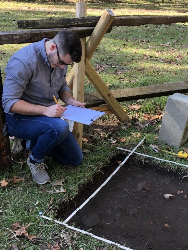 Ethan Shuler, junior at Charleston Southern University, documents the layout of a new dig site