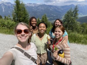 Travel Abroad Students|Students Abroad|Students abroad|A man (right) holds a guitar and a woman (left) holds a different instrument. They are ready to practice music notes|A boy walking through a city|A boy sitting on a wall and enjoying the view and sunset|Jill Terhaar Lewis|Jill Terhaar Lewis||Canterbury Cathedral Choir in Residence June 2012|Two girls (right) and a boy (left) smiling at the camera|A plate with food
