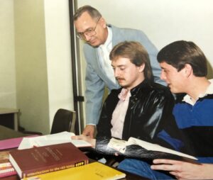 Dr. S.M. Mayo works with students in an Old Testament Survey class.