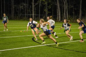 Women playing football.