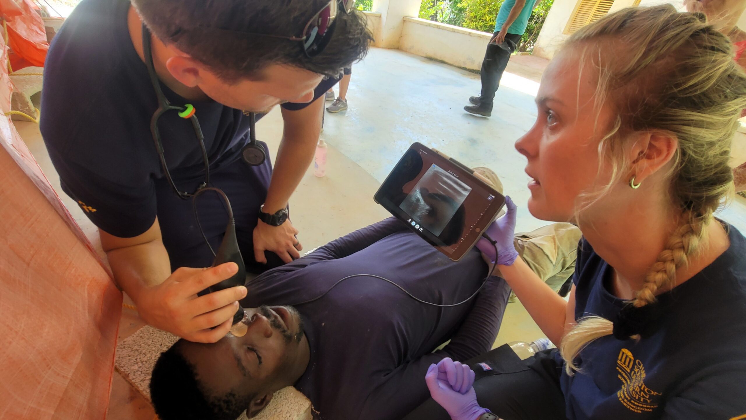 Josh Taryn performing an eye ultrasound