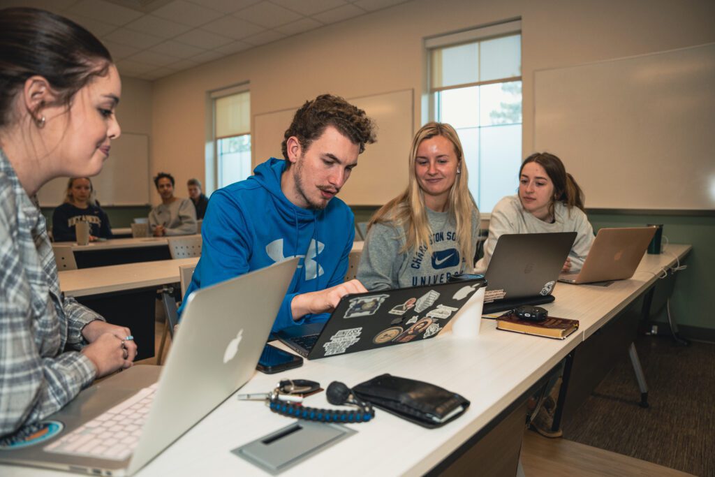 Students discussing the material in class in groups