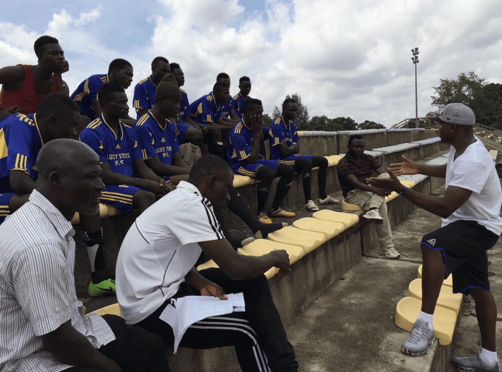 Paul Gombwer, a former member of the CSU men’s basketball team, speaks to a team in Nigeria