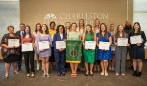 Multiple people earning their sigma Beta Delta diploma